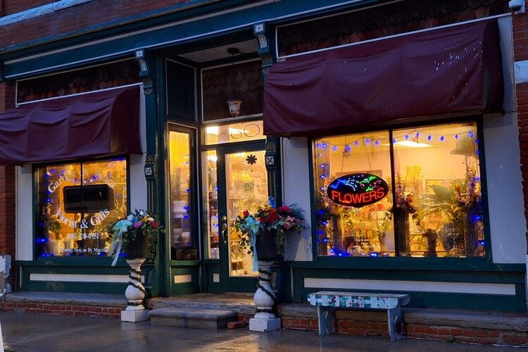 Garden of Peace Floral and Gift on 602 South Market Street in Marine City displays blue lights in front of business in support of autism awareness.