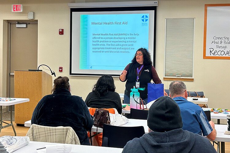 Adrienne Luckenbacher, Mental Hhealth First Aid Trainer at St. Clair County Community Mental Health leads the training with a group of Blue Water Developmental Housing employees.