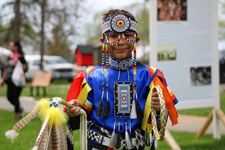 A participant in the Children's Fancy Dress poses for a photo before his dance begins.