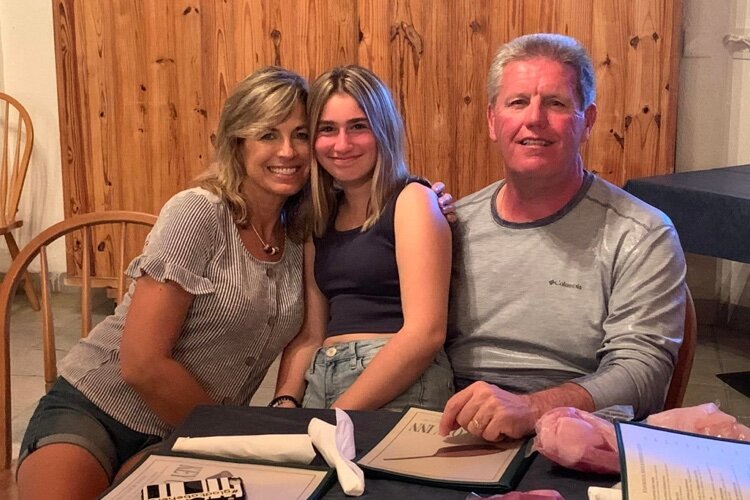 Stacy and Paul Zimmer, with their daughter Rachel.