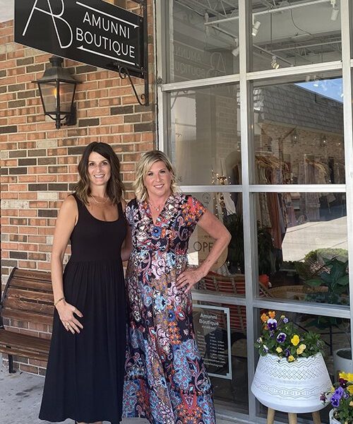 Amunni Boutique owner Ann Marie Oldford (left) and her friend Heather Benson, an MS advocate, pose for a photo outside Oldford's establishment in downtown St. Clair.