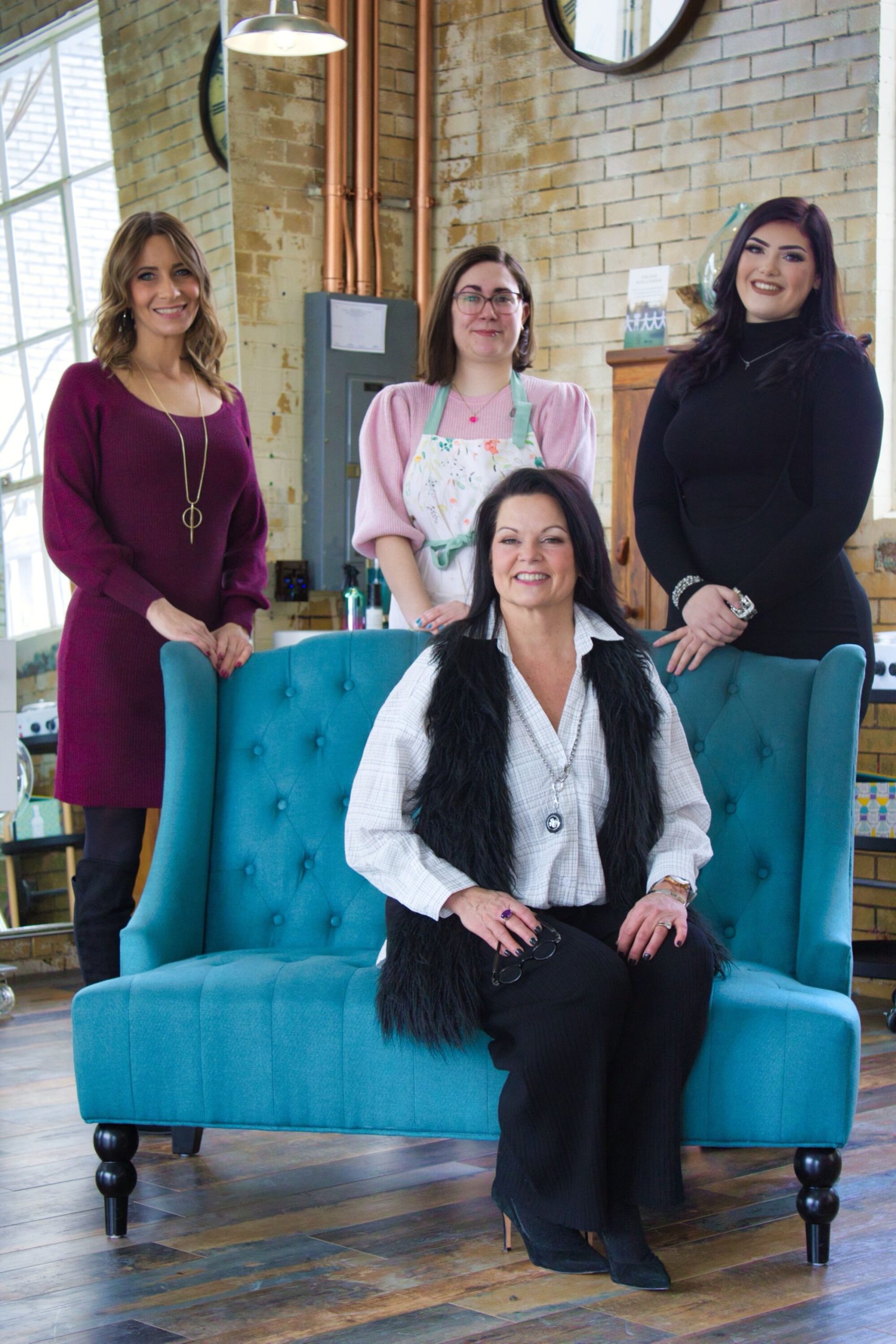 FUN FACT: AJ (center) likes going fast on her husband’s VMax 1700 motorcycle.