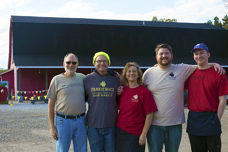 (From left) Stanley Pankiewicz III, Steve Pankiewicz, Theresa Pankiewicz, Josiah Pankiewicz, and Andrew Pankiewicz pose for a photo at Pankiewicz Cider Mill & Farm Market on Sunday, Oct. 17, 2021.