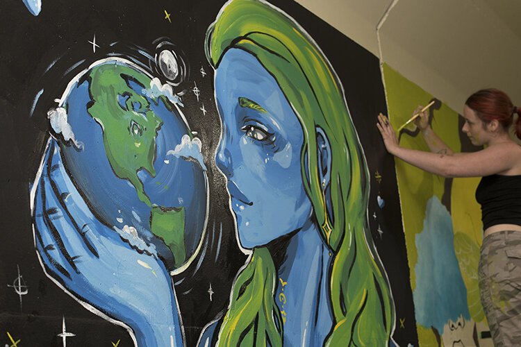 Part of the Making Muralists project, Grace McCarthy's artwork is displayed along with 35 other artists' work in the Military Street tunnel along the Blue Water River Walk in Port Huron.
"The value was in learning some tips and tricks, but we didn't teach anybody how to paint. Everybody came here with those skills already," says Jody Parmann, organizer of the event as well as artist and local business owner. "We really focused on how to get their image from a small size to a grand scale, but also what it takes to quote a job, what to consider, how much to charge for your time — that sort of thing."