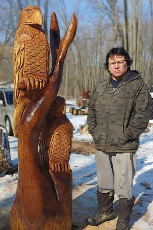 Artist Garrett Nahdee with his artwork. (Photo courtesy of Garrett Nahdee)