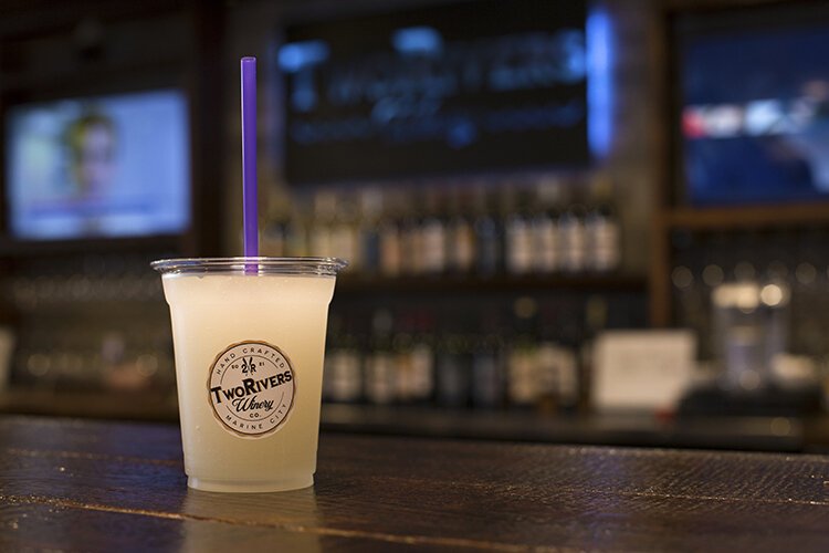 Customers can stop in each week to try a new featured flavor of wine slushy. Pictured here is the Moot Mango.