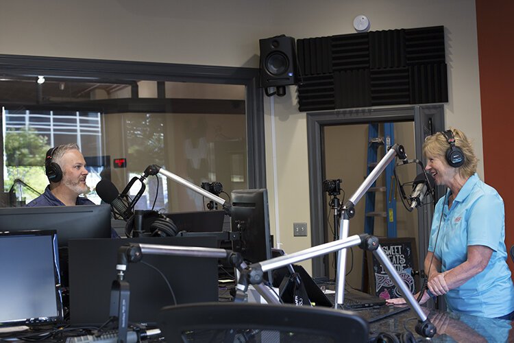 Hosts of "Mornings with Brian & Ellyn" Brian Smith and Ellyn Davey work in the studio on Wednesday, June 23, 2021. 

"We like to add as much fun as possible," says Smith. "We also want to be a great neighbor to the people that are around us, but we also share a lot of hope. And so I think those are three things that are really important to us."