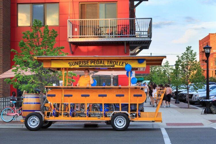 The Sunshine Pedal Trolley offers a view of Bay City’s popular eateries and nightspots. (Photo courtesy of Great Lakes Bay Area CVB)