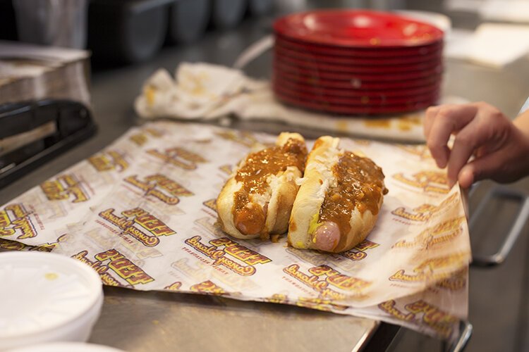 A server prepares a takeout order at Ted's Coney Island in Port Huron, Michigan.