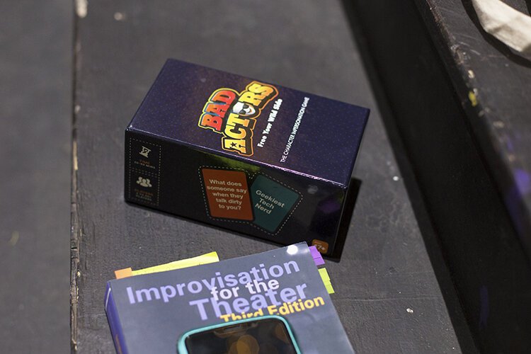 Reference materials for theater exercises lie on a staircase during Enter Stage Right's ESR Improv Lab at The Citadel Stage. 

Executive Director of ESR, Regina Spain, says that they are starting the improv classes in small gatherings as a way to reconnect and work on their improv skills.