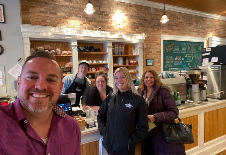 Landmark Academy staff make a quick stop at Kate's Downtown for caffeine and to support a local business.