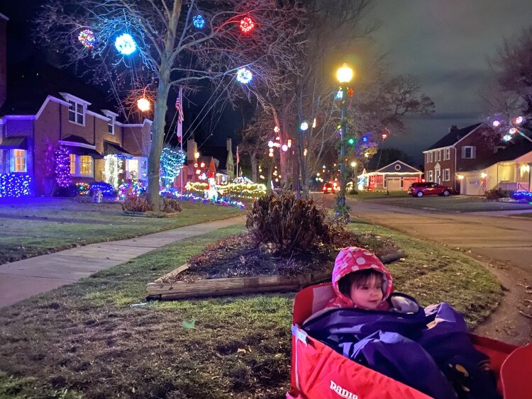 Lucy Freed enjoys holiday lights around the neighborhood