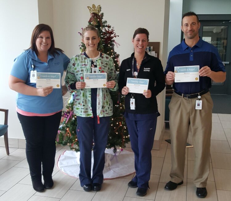 Port Huron McLaren staff like Terri King Tews, Jourdan Mills, Bonnie DePalma, and Tim Nemechek receive Guardian Angel awards for going above and beyond to care for patients.