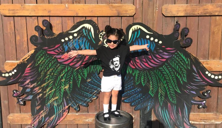 Angel wings behind The Raven Cafe are a great place to snap a photo.