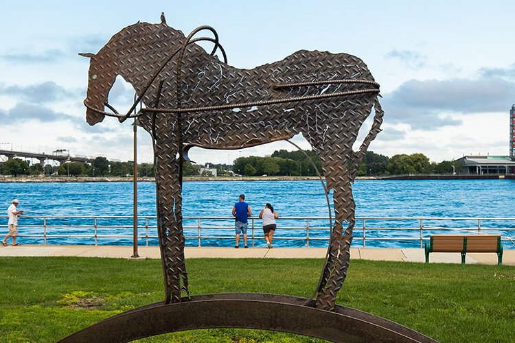 A variety of artwork lines the river walk in Port Huron.
