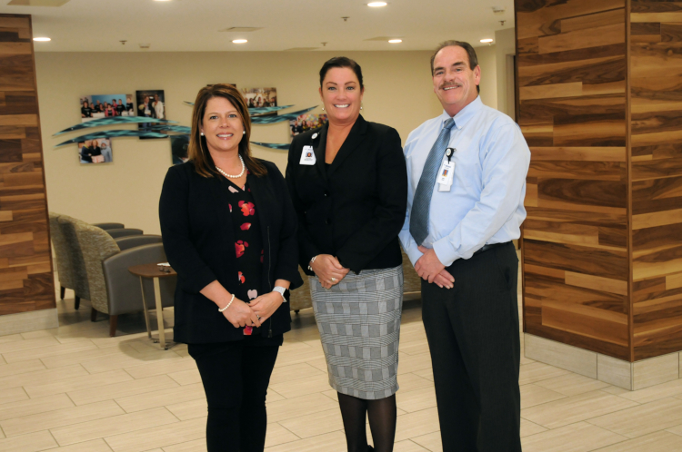 Lynn Griffor, foundation executive director, Jennifer Montgomery, hospital CEO and Jack Belyea, director of Facilities stand in the new lobby made possible by donor funds.