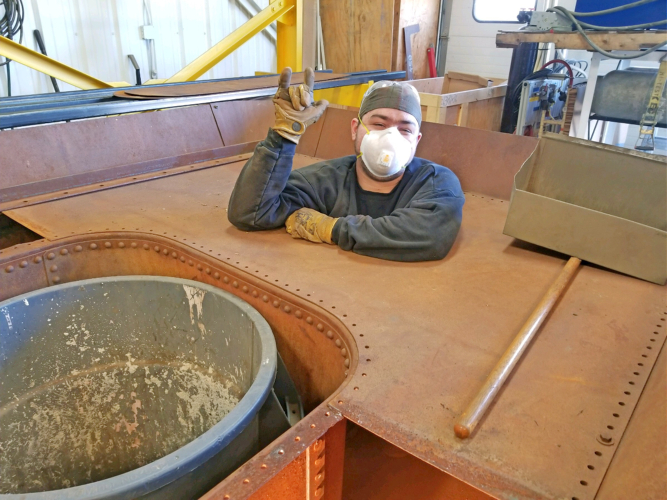 T.J. Gaffney works on the D.B. Harrington