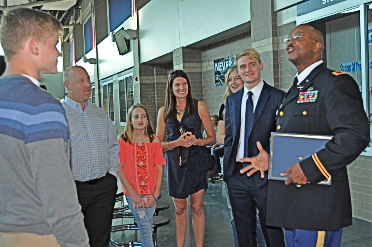 Col. James Ramsey, right, chats with R.J. Russel and his friends./Karen Hain