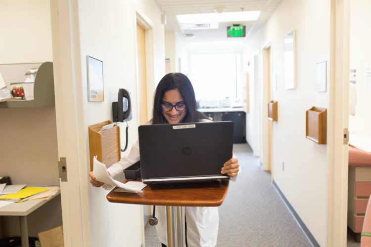 Dr. Sushma Reddy finishes paperwork.