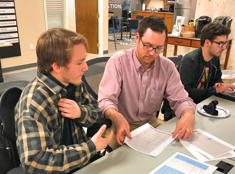 Quentin Bishop (right) chats with Ethan Smith about is pizzeria plans.