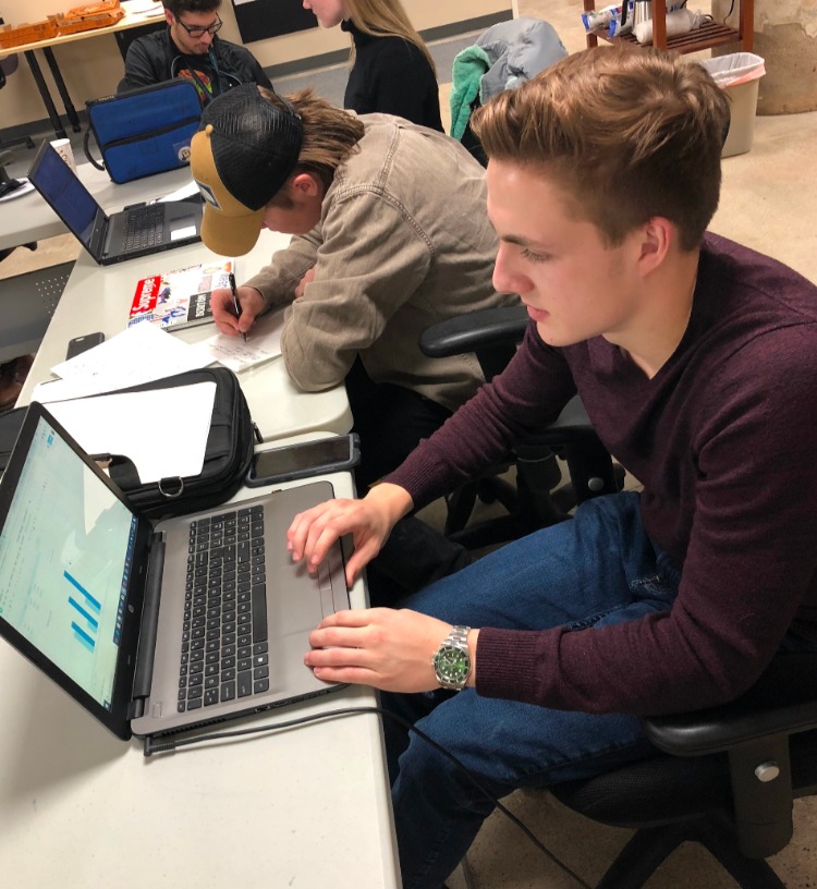 Derek Olbrys works on his business plan