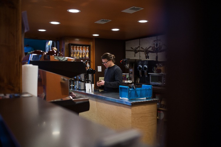 Nathaniel Bottenfield works behind the scenes at Exquisite Corpse Coffee.