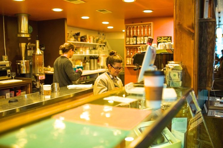 Maggie Bottenfield works behind the counter at Exquisite Corpse Coffee House