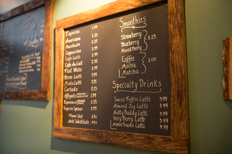 Coffee options are spelled out on the wall at Exquisite Corpse Coffee.