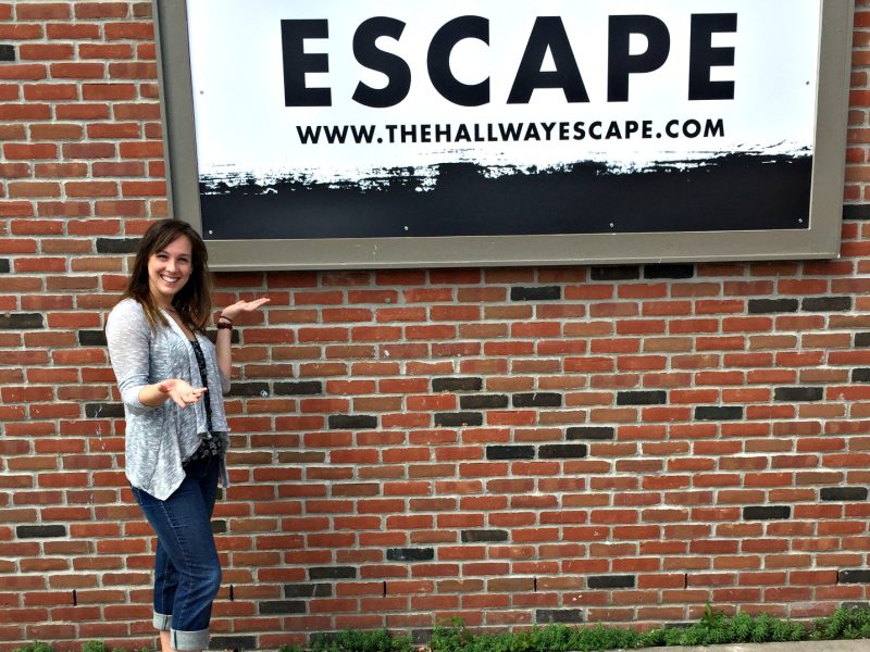 Carol Hall stands outside her new business, The Hallway Escape, in downtown Port Huron.