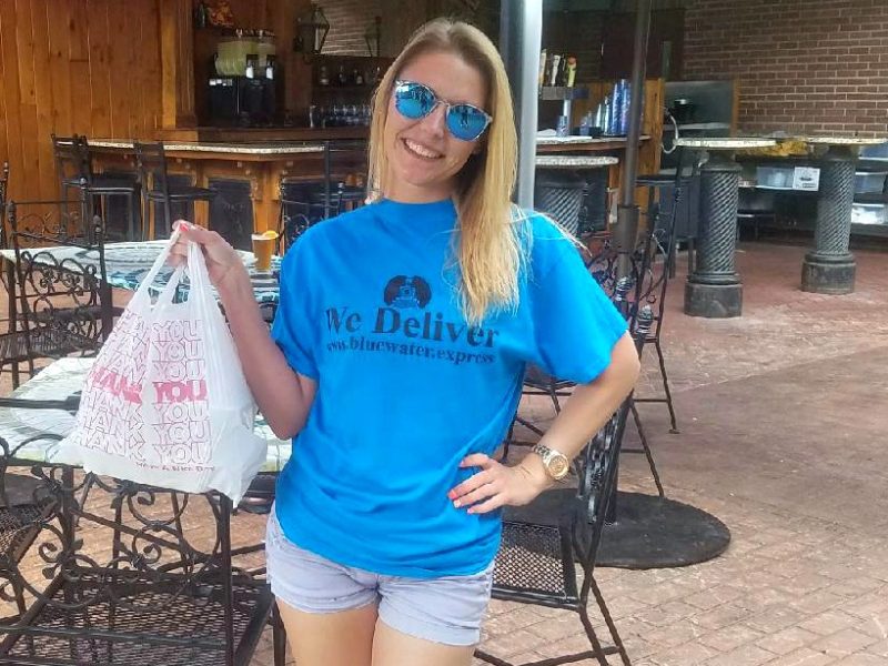 Driver Karlie picks up a delivery order for a hungry customer.