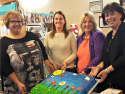 Lynn Vinson, owner of Touchstone Services and A Little Something, Stacey Redfield, director of Touchstone Services, Sallie Smith, employment coordinator for Touchstone Services, and Lucie DeLine, manager of A Little Something celebrate the store's fi