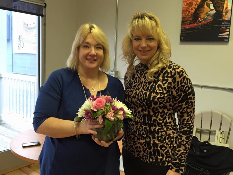 Sallie Smith receives a gift for earning the Nonprofit Manager of the Year award from BlueWater Woman