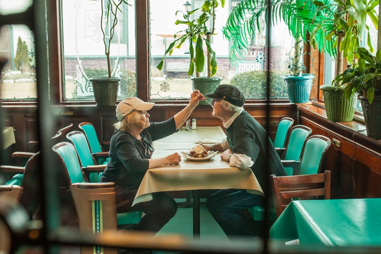Gayle and Rock Stevens share a sundae at their restaurant.