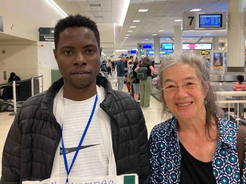 Newcomer Mohammed arriving at the airport to a welcome from Ruth, a member of the Cassopolis, Mich., private sponsor group that worked with Zaman during the 90-day resettlement period