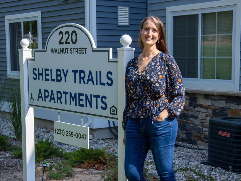 Kittie Tuinstra outside of the new Shelby Trails Apartments.