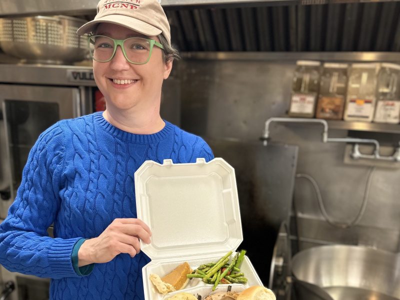 Sarah Jones with a to-go meal from Mid City Nutrition