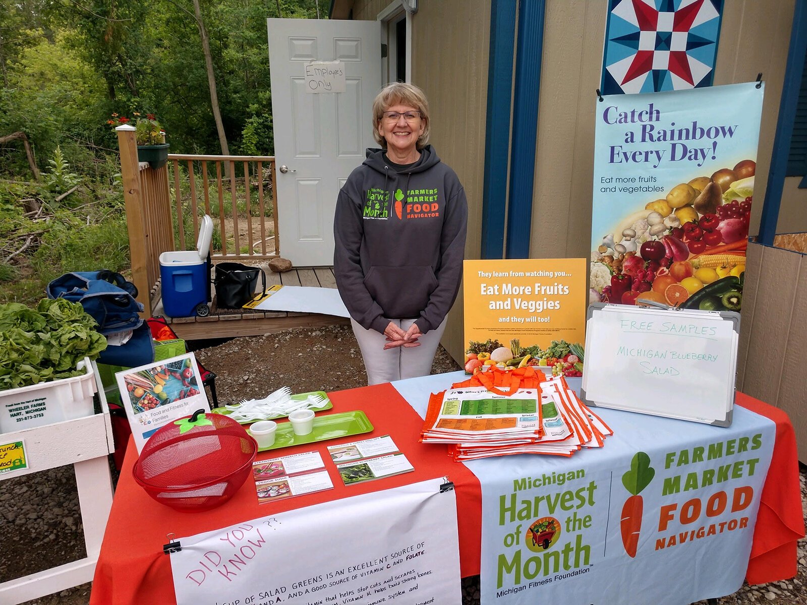 Cathy Rayburn staffs a table offering nutrition information to the public.