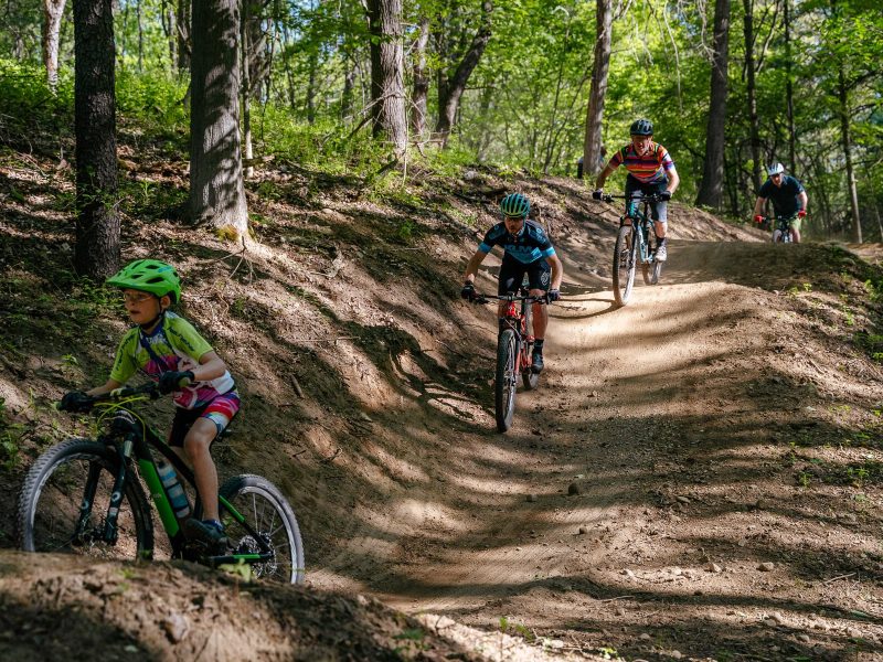 From left, Tyler and Adam Pokowski, Steve Vigneau, and Wade Robbins ride the Shelden Trails at Stony Creek Metropark.