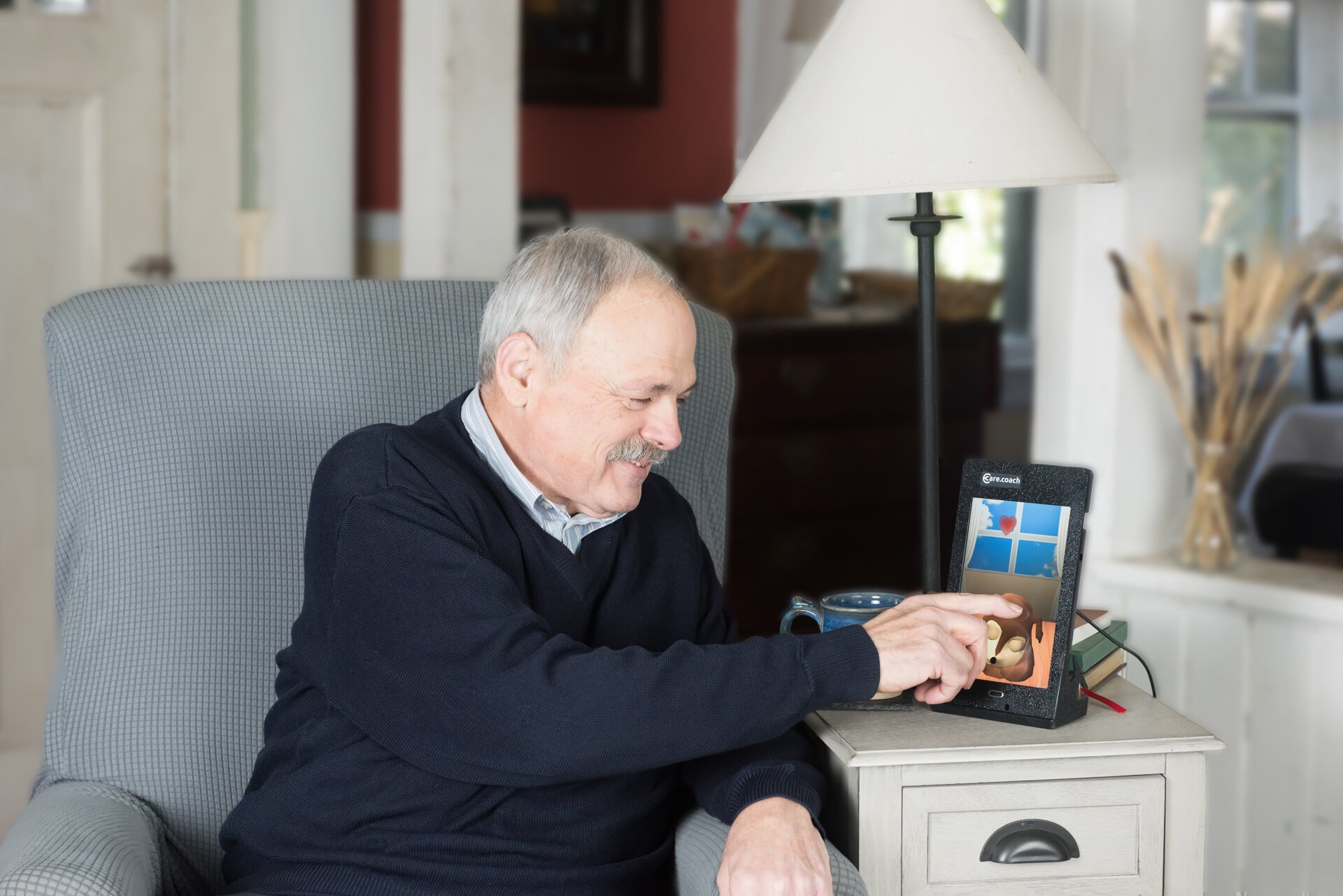 A man uses the care.coach tool, currently being deployed by Grand Rapids-based Care Resources PACE.