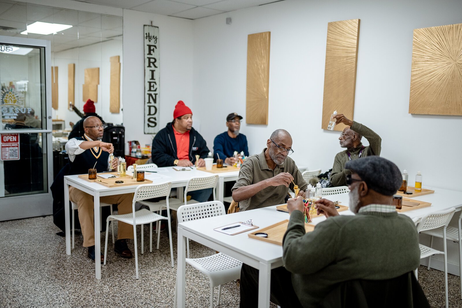 Food and Friendship Connections participants create candles during a social outing to Wicksup Candle Co. in Oak Park.