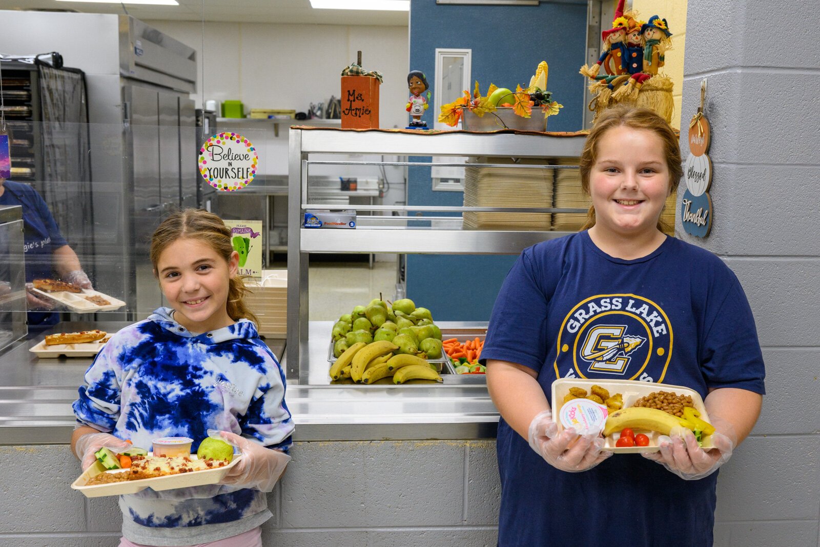Students at Grass Lake's George Long Elementary with their lunches.
