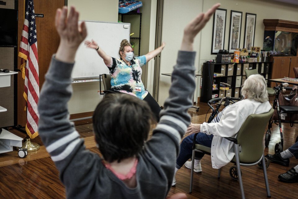 Lacey Cole leads a seated aerobics class at the LifeCircles Center in Muskegon. PACE participants are encouraged to stay active and move their bodies with low impact exercise, keeping them mobile and independent for longer.