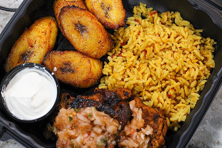 Doña Marina’s Pollo Asado with maduros and Spanish rice.