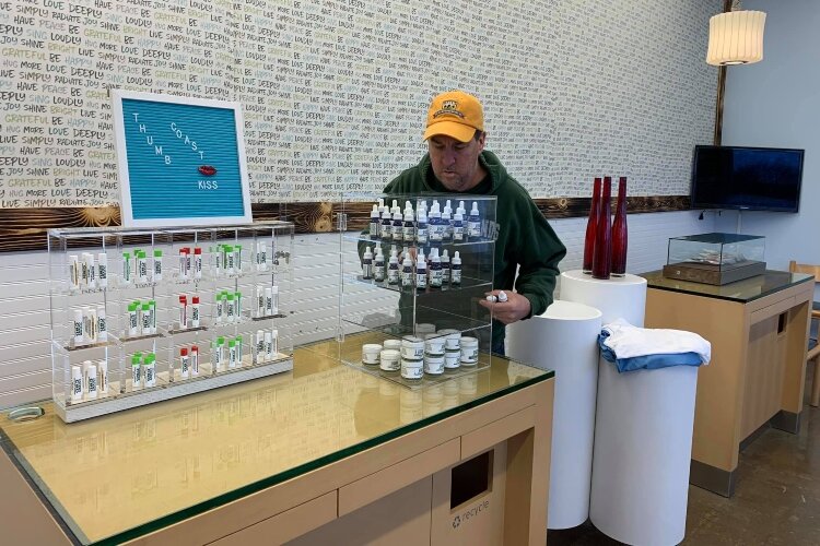 Shelves are stocked to prepare for Thumbcoast CBD's opening