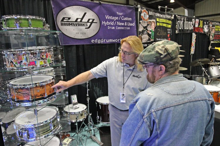 EDG Drumworks staff discuss the characteristics of a drum to customers.