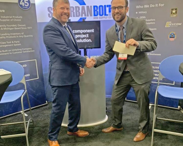 Eric Peterson congratulates a winner during MDEX 2019.