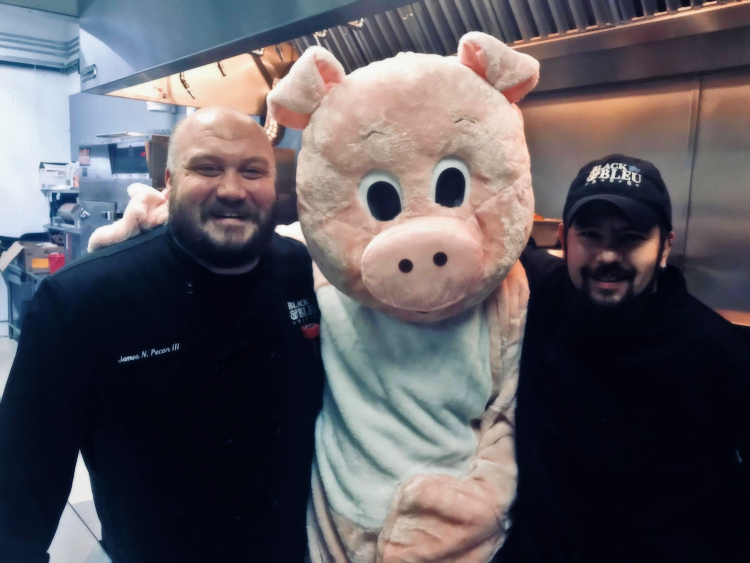 James Pecor and staff celebrate the opening of Black & Bleu BBQ in St. Clair