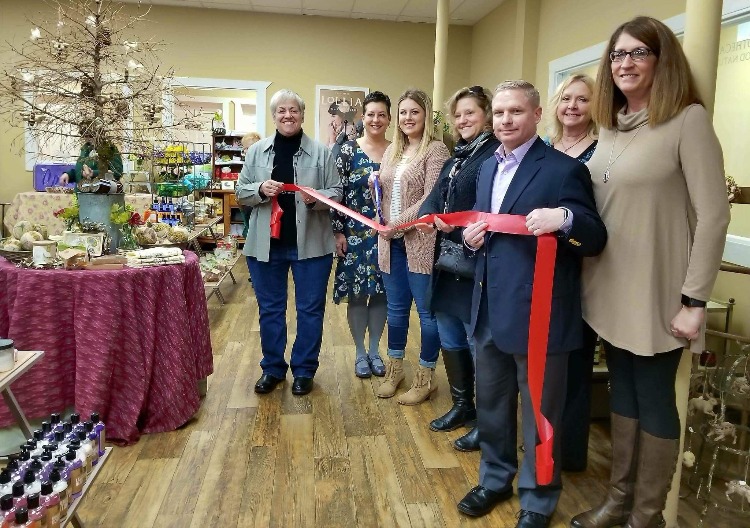 Jackie Morren, second from left, marks the grand opening of The Apothecary with the Marine City Chamber of Commerce.